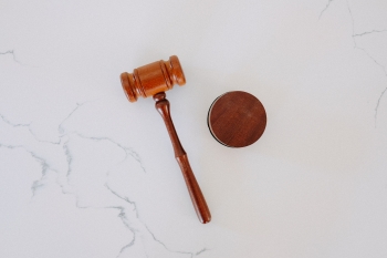 A wooden gavel used by judges in courtrooms