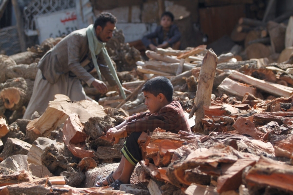 Yemeni boy sat among Sana’a’s ruins
