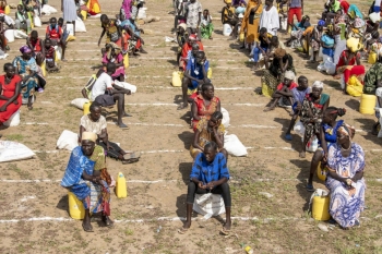 South Sudanese refugees practice social distancing at Kakuma camp in Kenya