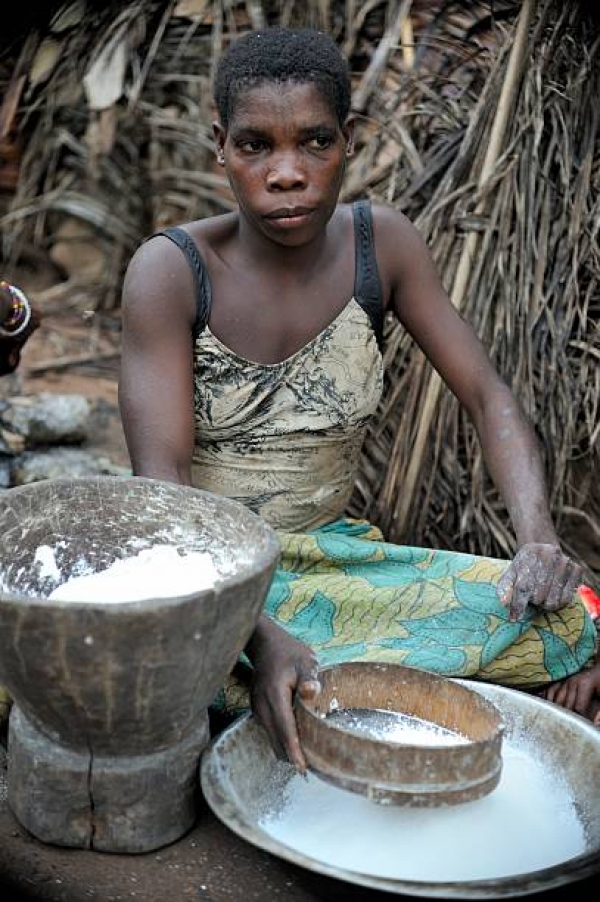 African woman while cooking food