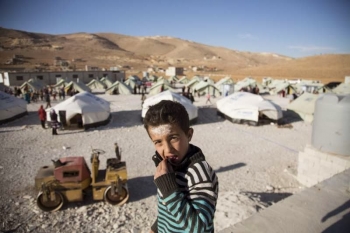A Syrian boy at a refugee transit site in Arsal, Lebanon