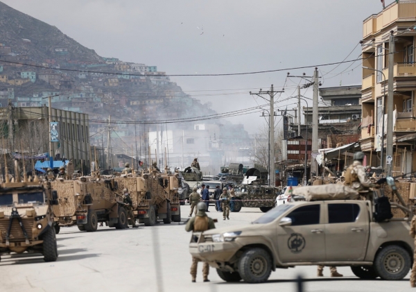 Afghan forces near the Sikh complex in Kabul, after the attack