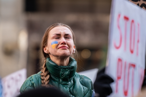 A woman calls for peace in Ukraine during a demonstration
