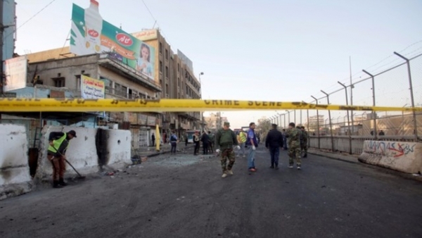 Iraqi security forces on the site of the bomb attack in Baghdad