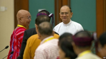 President Thein Sein, center, meets leaders of armed ethnic groups during a meeting for the Nationwide Ceasefire Agreement (NCA) in Naypyidaw, Myanmar, Sept. 9, 2015