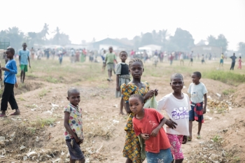 Kids playing on the mass graves in the Nganza area, in the capital of Kasai, Kananga.