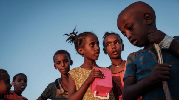 Ethiopian children who fled Tigray wait for food to be distributed in Gadaref refugee camp, eastern Sudan  