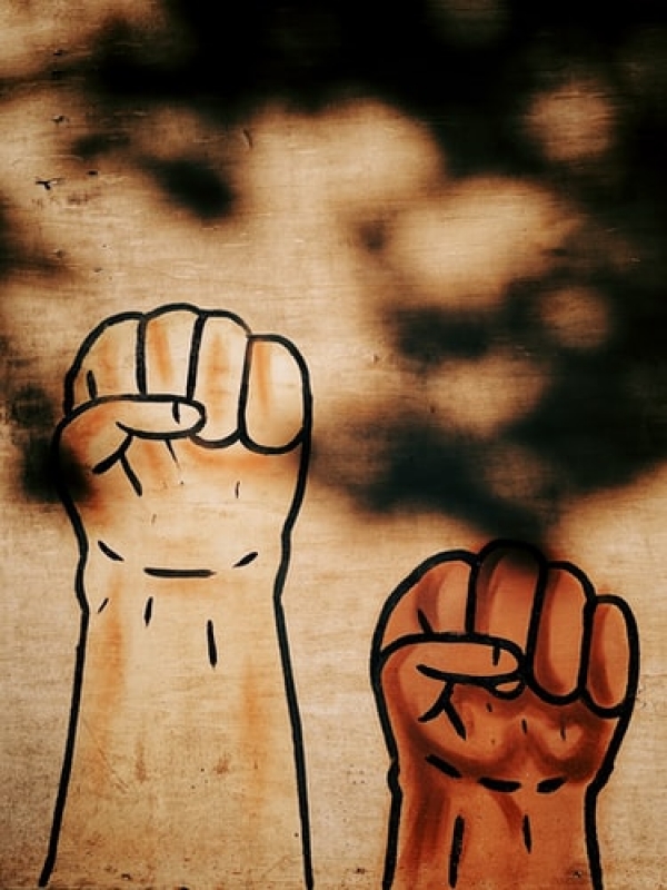 Artwork of raised fists representing justice