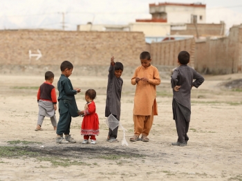 Children playing with a kite