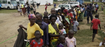 Congolese refugees wait in line for the verification process in Uganda.