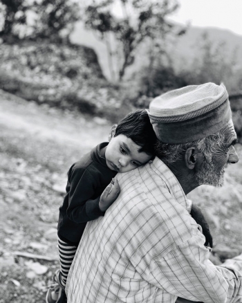  A child with an elderly man
