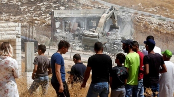  Israeli army excavator demolishing a Palestinian building in Wadi Hummus, 22 July 2019